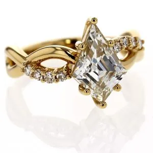2.06 carat kite shaped diamond ring that is set with 8 single cut diamonds